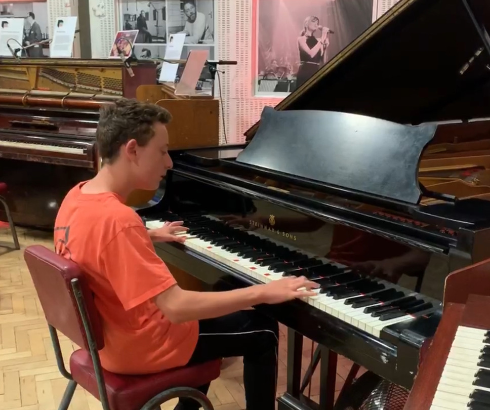 Sam Rubin playing a grand piano